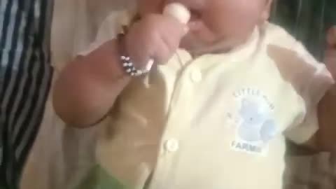 3 month baby eating lolypop...