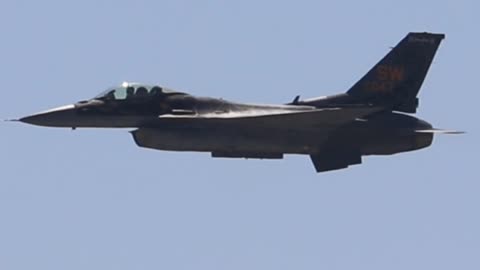 F-16 making a high speed pass and making a steep climb