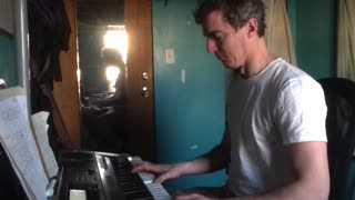 playing keyboard in room in Bushwick, Brooklyn, New York