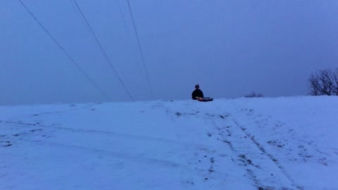 Carson Sliding Down a Hill on a Snow Sled, Try 2