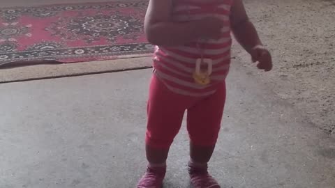 The little girl is just starting to walk.