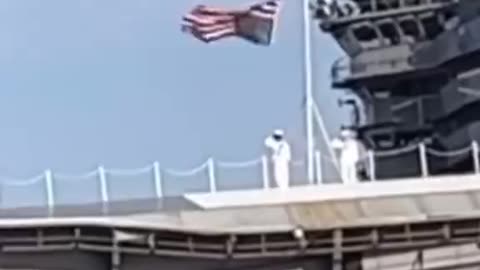 A US sailor saluted the Stars and Stripes which was hoisted incorrectly.