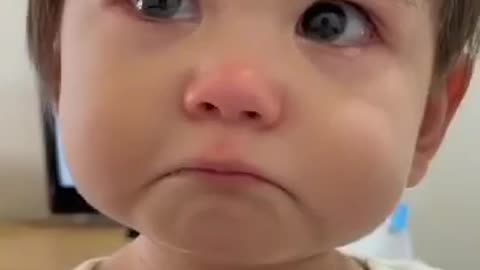 Cute baby boy try to express his emotions