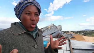 Ntombothanda Tyimbela trying to save what is left from her shack.