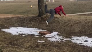 Guy slips in mud and does a front flips into grass