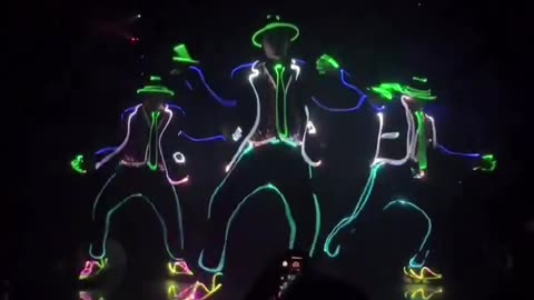 Mesmerizing Dance Routine: Performer Plays and Fools Around with Laser Light