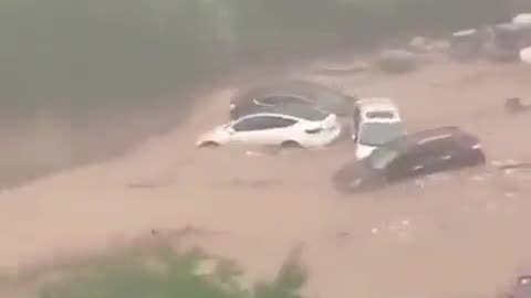 WATCH: Shocking footage of flood in China show vehicles being washed away. 😱😱😱