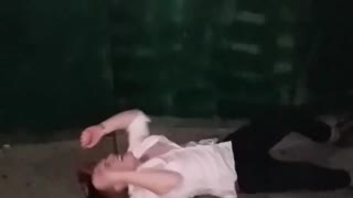 White shirt throws body into wooden wall