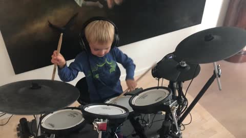 boy playing drums