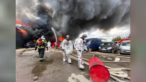 Firefighters extinguishing strong blaze at an oil base in Russia - Close-up footage of fire