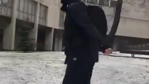 Guy skips on icy steps slips and falls