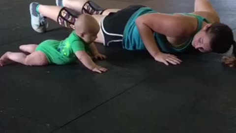 Baby Keeps Mommy Motivated During A Grueling CrossFit Workout