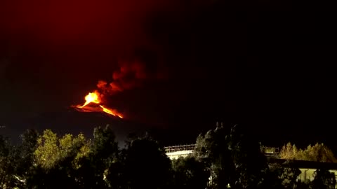 Mount Etna shoots lava into night sky