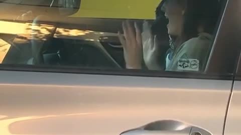 Woman Caught Excitedly Dancing in Car