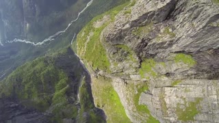 Breathtaking POV wingsuit flight over glacier