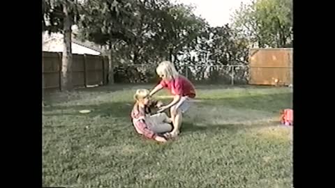 Young Girl Hits Another Girl In The Face With A Frisbee