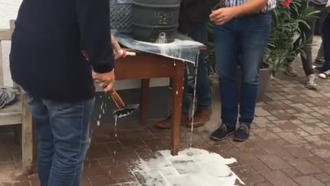 Three men can't tap beer keg