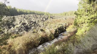 A Rainbow Arches Over the Lava Volcanic Rock & National Wild & Scenic Deschutes River – 4K