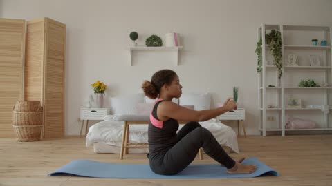 Girl doing sit-ups lying on the floor