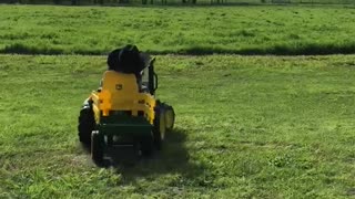 Kid Nods Off Driving Toy Tractor