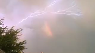 Crazy lightning show after storm and rainbow