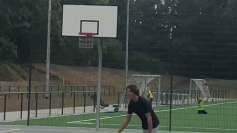 Guy white shorts basket ball falls on back