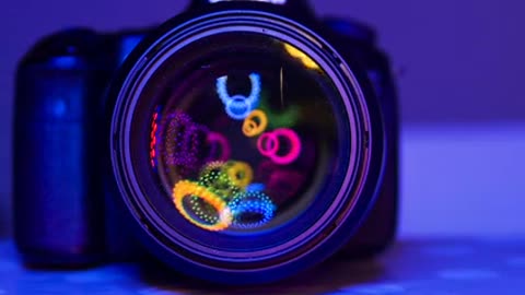 Dancing Lights Of Different Color Inside The Lens Of A Camera