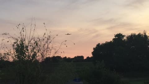 Airplane landing on home grass strip