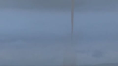 Waterspout Funnels Fill Horizon During Storm