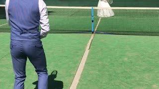 Bride and Groom Play Game of Tennis