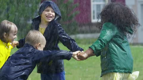 Children playing in the rain