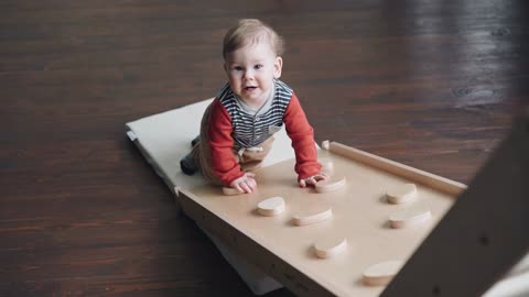 A Little Boy Trying to Crawl Up