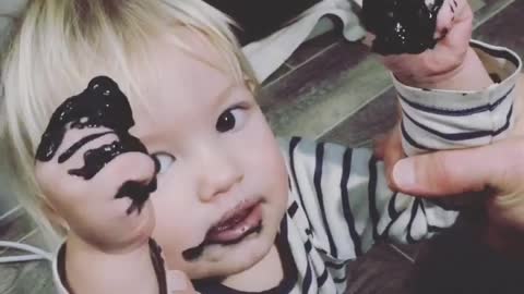 Baby eating paint