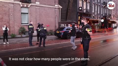 Amsterdam Hostage drama at Apple store ends as gunman hit by police car