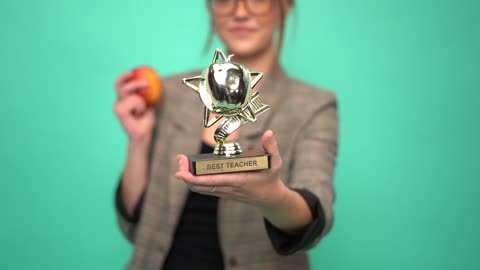 A Woman Holding a Trophy