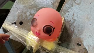 Doll Maker Places Eyes