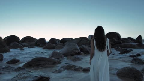 Woman Walking On Beach Towards Boulders _ Cinematic Shot _ Copyright Free Video