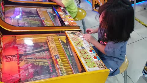 Atara Playing Indiana Jones Pinball Machine @ Age 4
