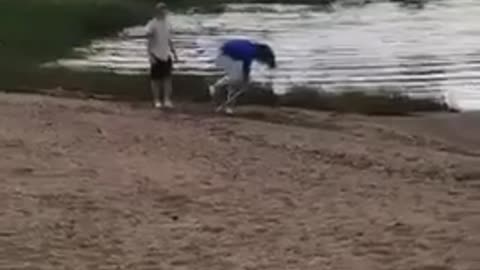 Dizzy bat blue sweater woman falls into lake
