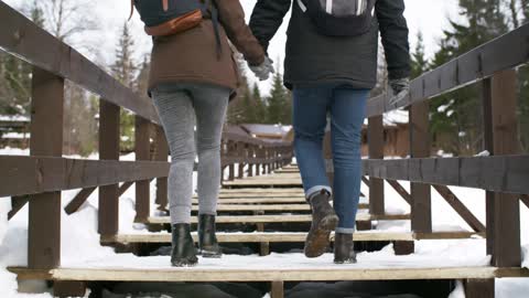 Couple crossing the bridge