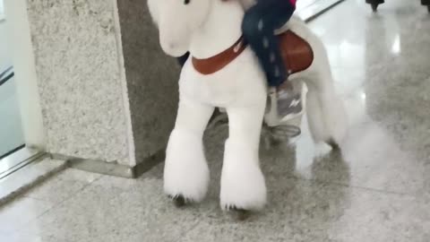 Mirha Eshal and Haris enjoying The toy Horse riding