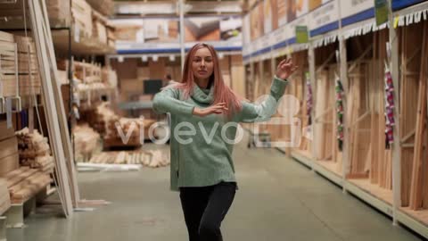 Young Girl Dances In Hardware Store Relaxfully