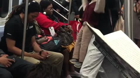 Two weird people acting out as dolls on subway floor break dancing singing