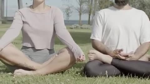 Couple Sitting on the Grass with their Legs Crossed #Shorts