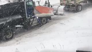 Snow Plow Shunts Truck up Slippery Hill
