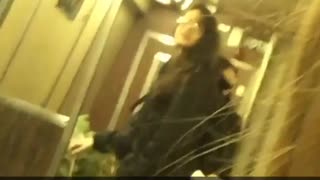 Woman black jacket carrying christmas tree on train