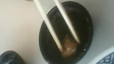 Practice eating bite size food using chopsticks.