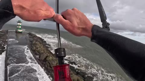 Epic Display of Skills: Guy Casually Kitesurfing Over a Pier!