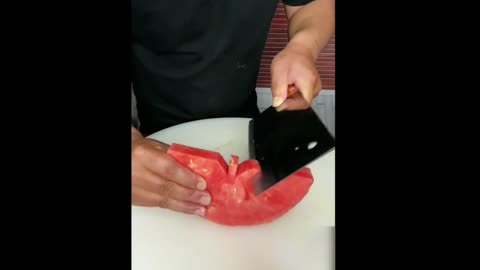 Cutting a butterfly out of a watermelon