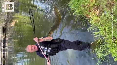 Breitbart News - Ohio Police Officer Assists 7-Year-Old Angler in Landing Massive 15-Pound Carp